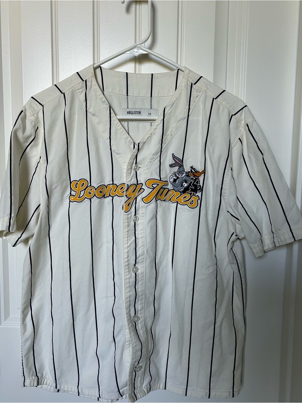 Hollister White Pinstripe Looney Tunes Baseball Shirt with Yellow Script